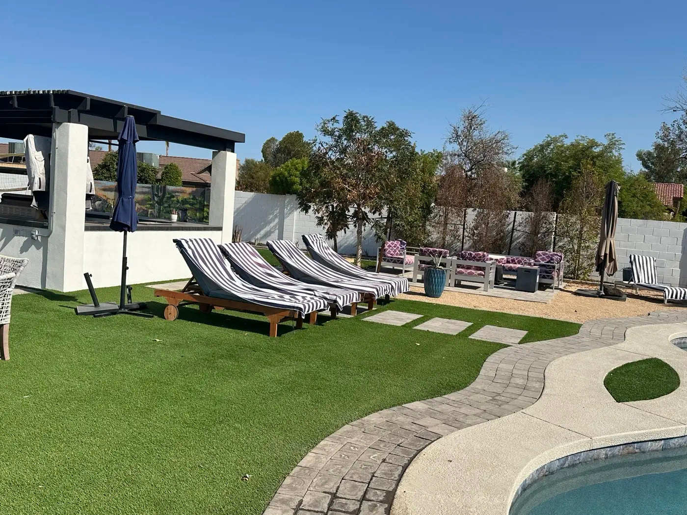 Poolside loungers and patio seating reset by Handy Girlz