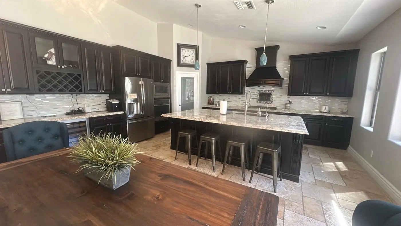 Dark modern kitchen island after a residential deep cleaning